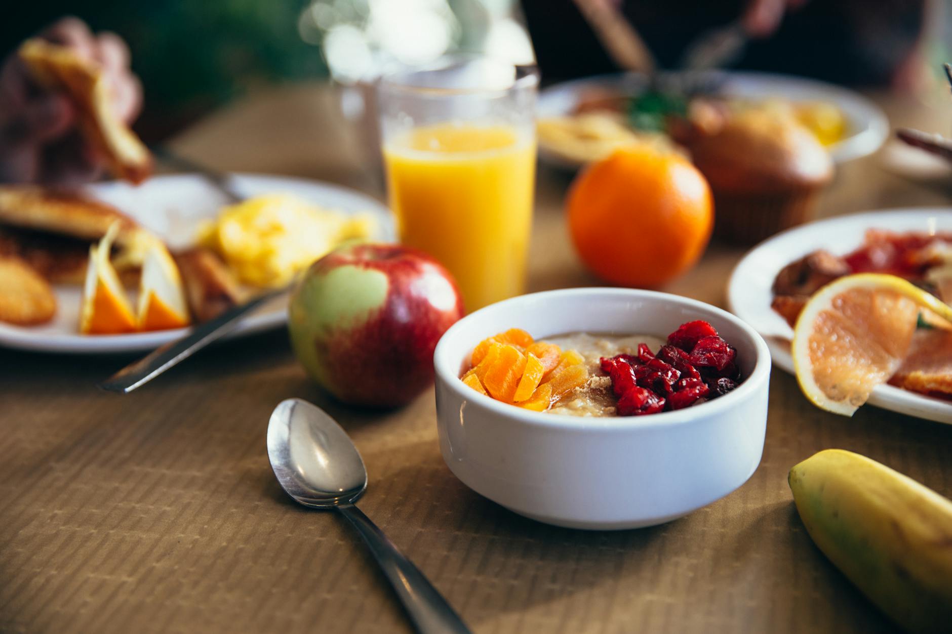 Phot of table with nutritious  food. Orange, apple, fruits, vegetables, others that are good for nutitional wellness