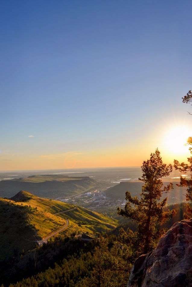 colorado mountains at sunrise.  Rays shining through the trees.  