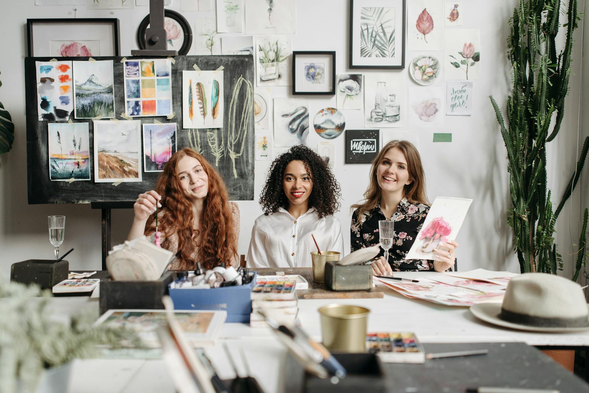 smiling women in the art workshop - craft night for creative wellness