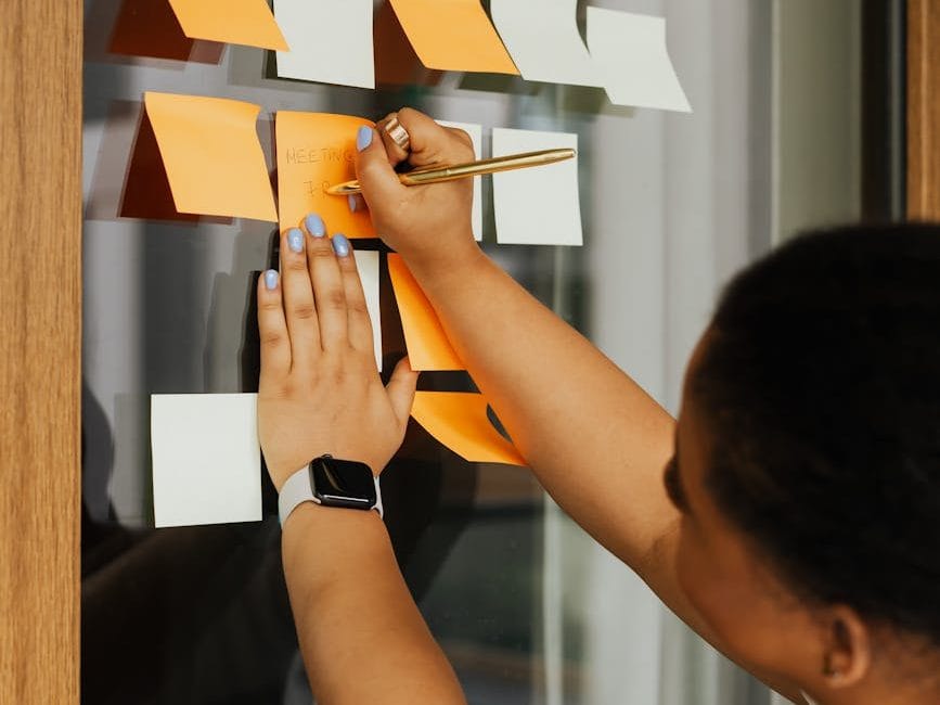 woman goal setting on sticky notes