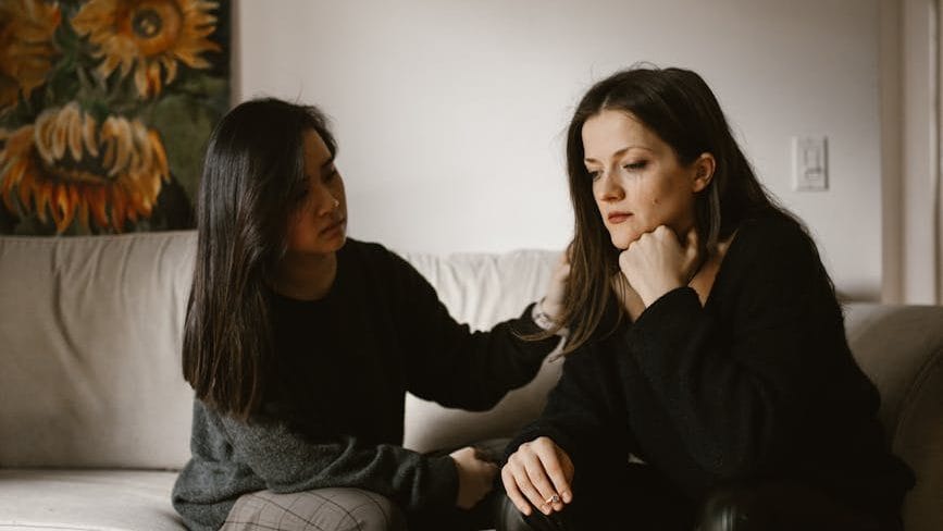 women having a conversation.  not receiving support for chronic illness