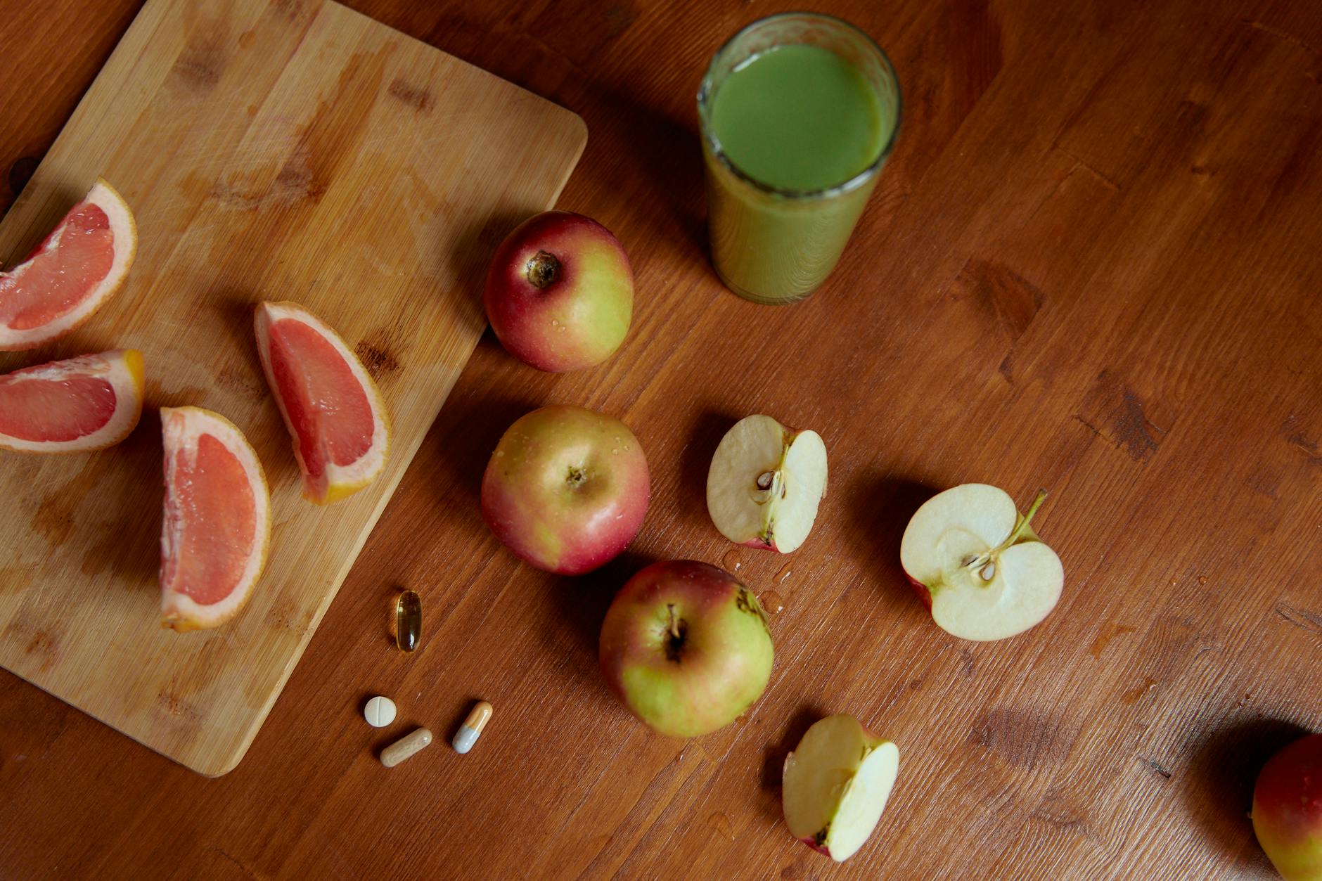 photograph of fruits near pills