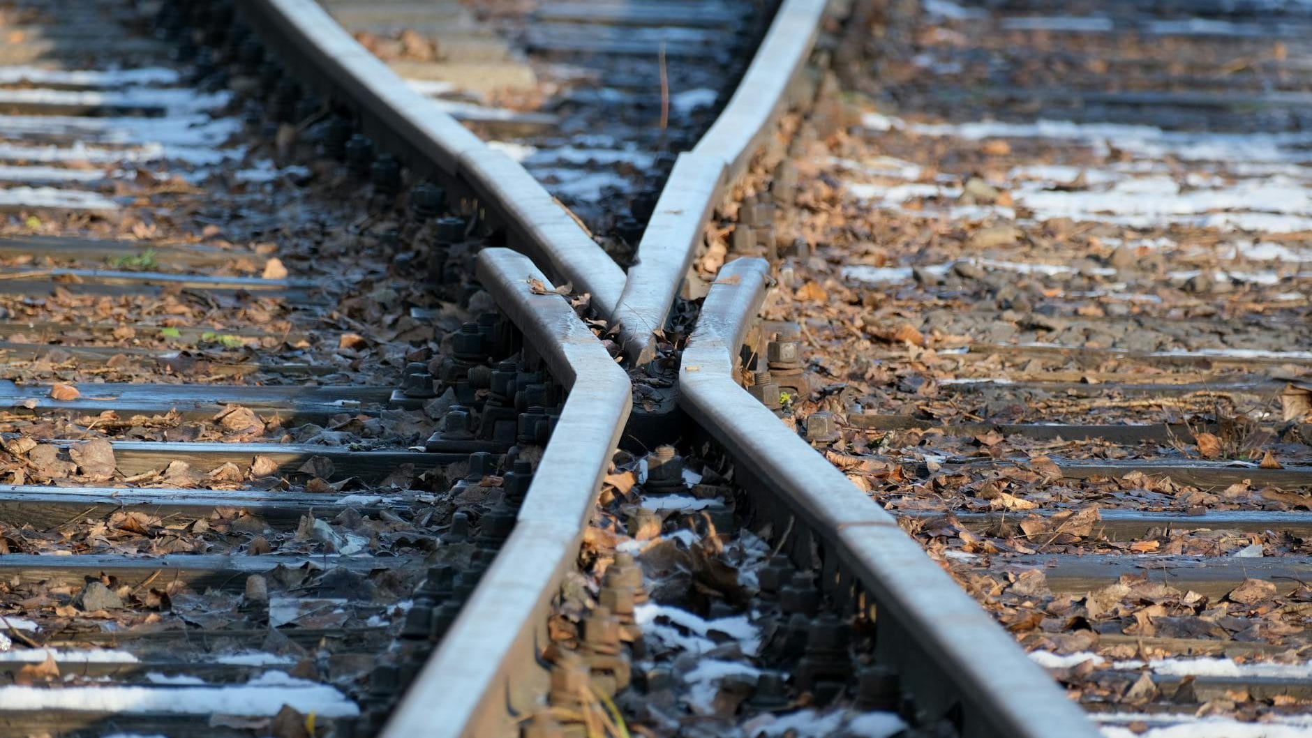 railway tracks merging in autumn scenery